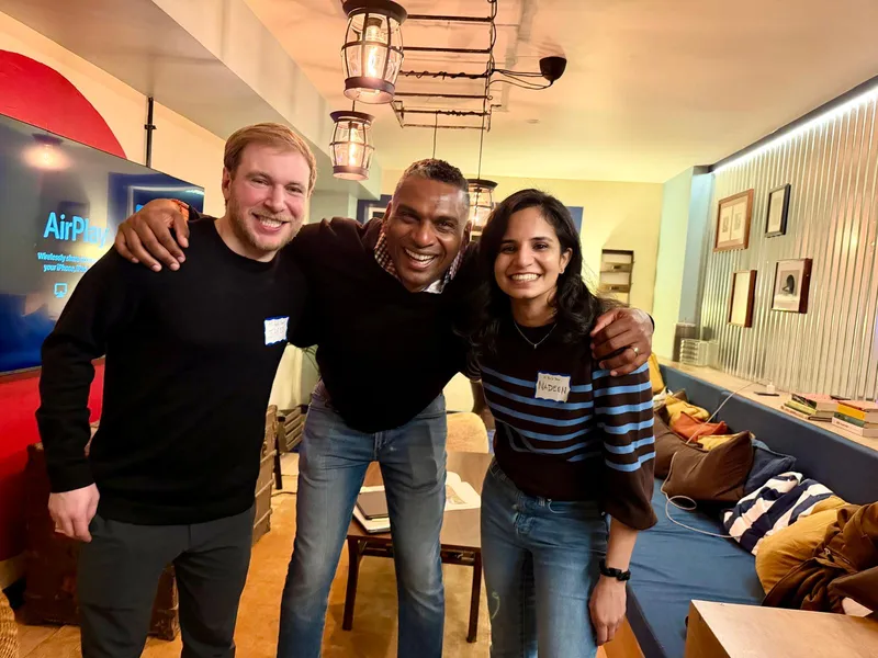 Three attendees at an AI Build Club event, March 2026