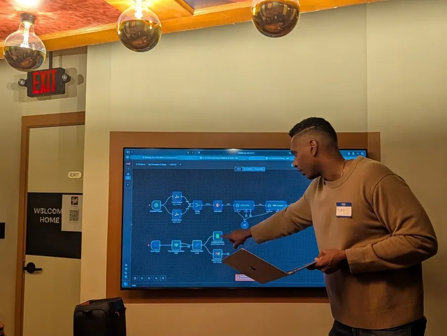 A presenter walking through a system diagram on screen at the February 2026 event