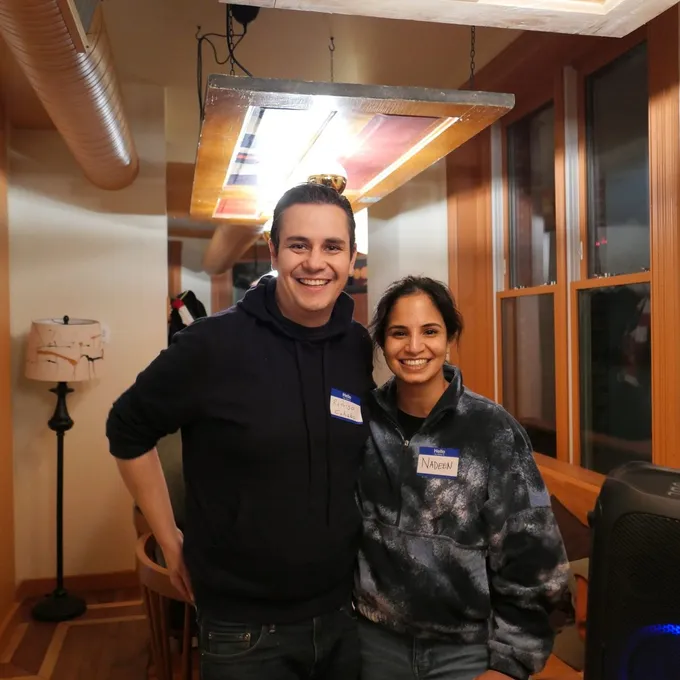 Two attendees posing together at the February 2026 event